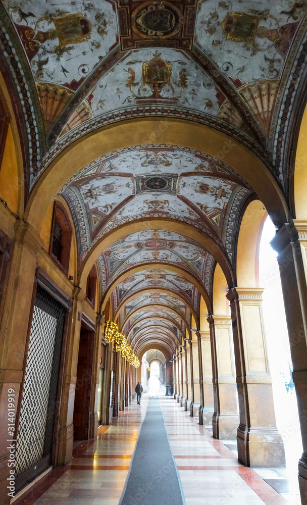Bologna arcades (porticos), Emilia-Romagna, Italy. Beautiful typical pieces of architecture in this medieval city that has more than 40 kilometres (km) of them. Vertical shot, daylight.