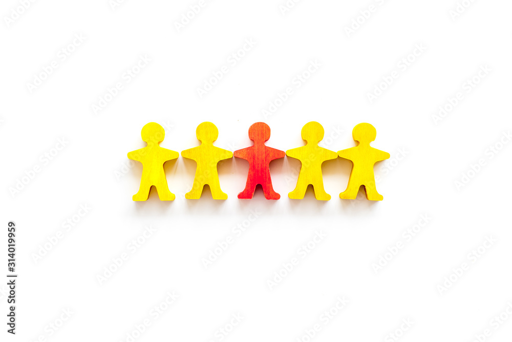 Leader concept. People cutuots - red figure against others on white background top-down copy space