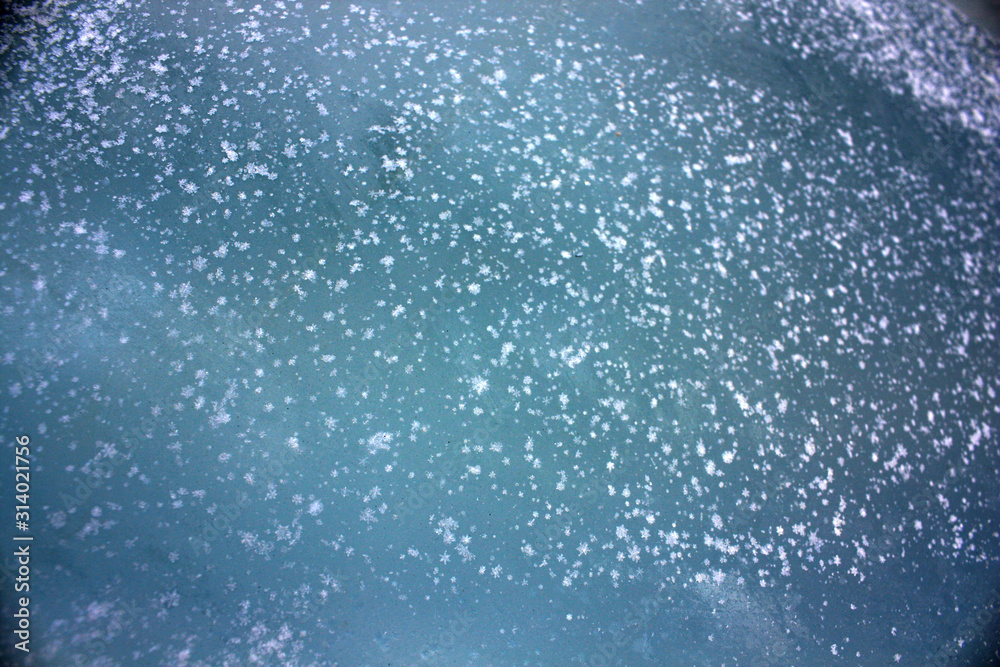 background of snowflakes on a blue background background of snowflakes on a blue background