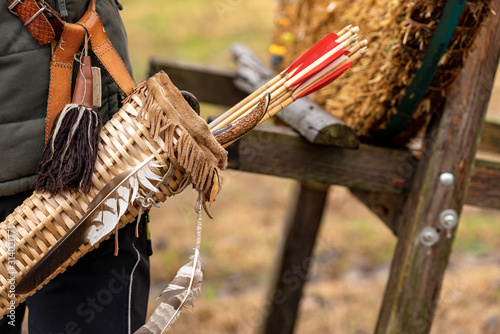 Fényképezés Close-up of an archer with a vintage quiver and wooden arrows - Archery sport, l
