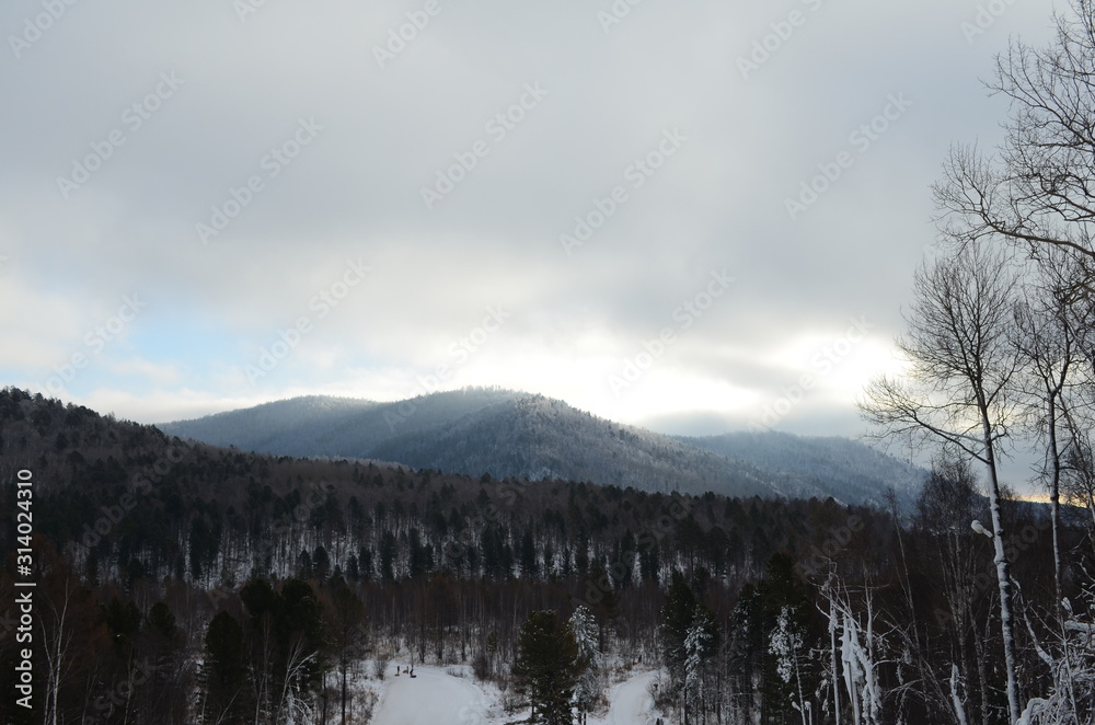 Fototapeta premium Winter hills near Angara river source