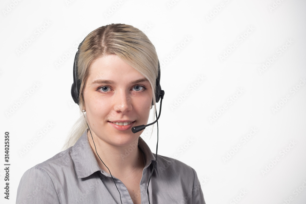 Portrait of attractive business woman with headset isolated over white background with large area for your text. Portrait of attractive business woman with headset isolated over white background with large area for your text.