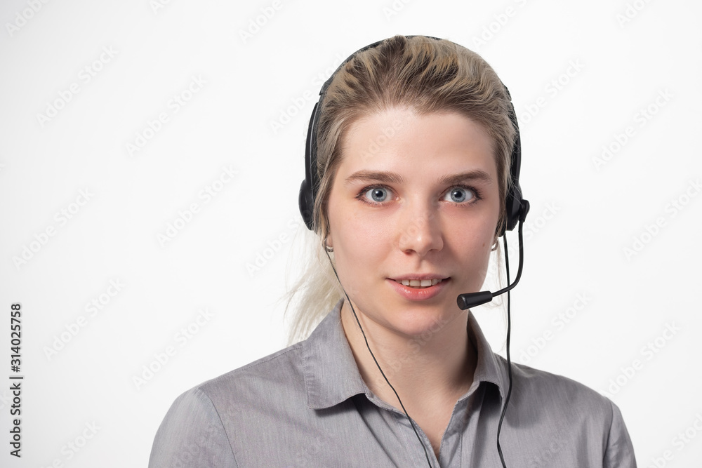 Portrait of attractive business woman with headset isolated over white background with large area for your text. Portrait of attractive business woman with headset isolated over white background with large area for your text.