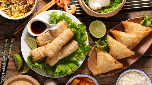 assorted of asian food, spring roll- samossa- dim sum- fried noodles photo