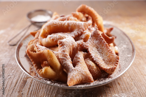 Fototapeta Naklejka Na Ścianę i Meble -  traditional french bugne- donut with sugar