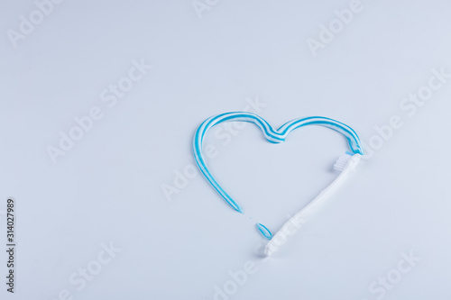 Toothbrush with colored toothpaste, care for the oral cavity and teeth, vector.