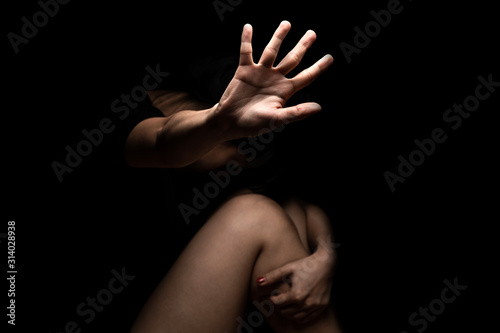 International Human Right day Concept: a girl with her hand extended signaling to stop