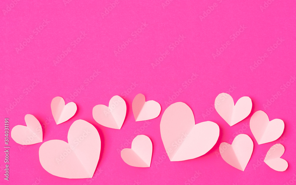 Shape of heart flying on pink paper background.