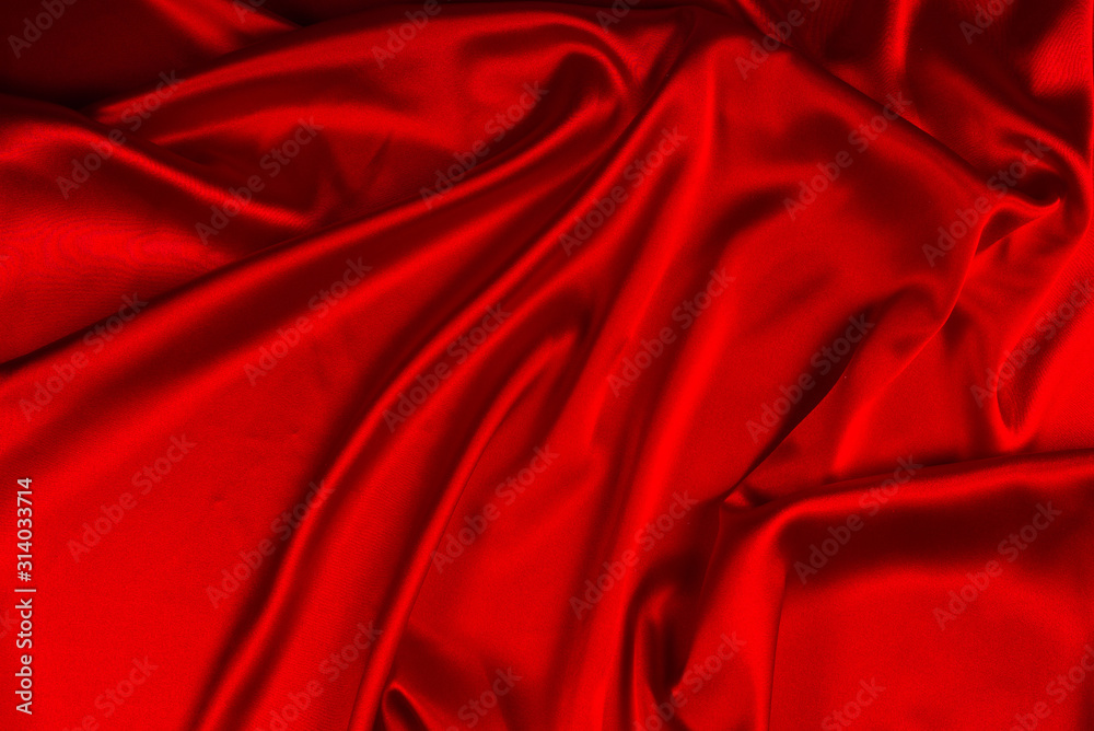 Red silk or satin luxury fabric texture can use as abstract background. Top view. Red silk or satin luxury fabric texture can use as abstract background. Top view.