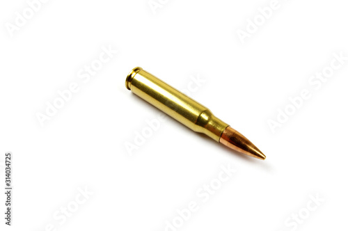 one single rifle bullet on a white background 