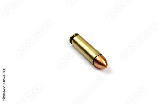 one single pistol bullet on a white background 