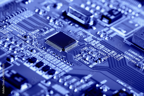 Electronic circuit board with electronic components such as chips close up. The concept of the electronic computer hardware technology. 