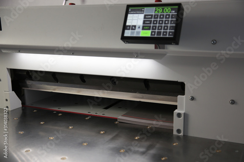 Part of printing machine for cutting cardboard in printing. Cutting, laminating machine