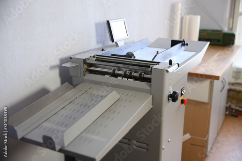 Part of printing machine for cutting cardboard in printing. Cutting, laminating machine
