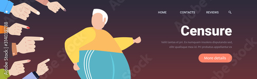 depressed overweight man being bullied surrounded by fingers pointing on upset fat male character peer violence victim of bullying mocking public disapproval concept portrait horizontal copy space
