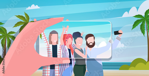 blogger using smartphone camera photographing happy travelers group on mobile phone blogging shooting vlog concept summer vacation seascape background portrait horizontal vector illustration