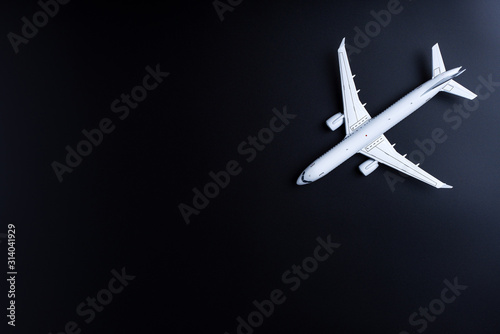 Jet airliner on black background. Plane crash and air incident. The tragedy, deaths, victims and injuries concept