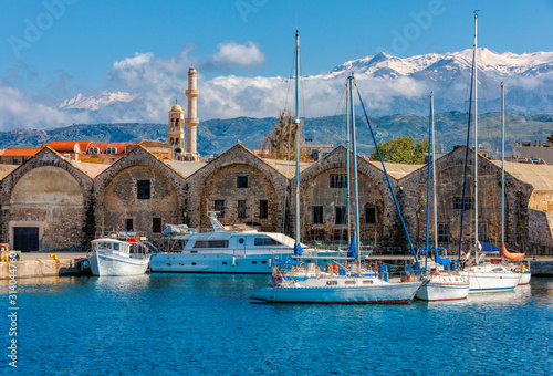 Yachts and boats moored near the Venetian Neoria, Chania, Crete, Greece. photo