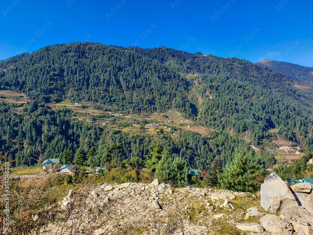 NEPAL, OCTOBER 29, 2019: On the trekking way from Phaplu (Salleri) to Taksindu La Pass, Himalayas, Nepal. Everest base Camp trek. View on local nepalese village houses (lodges).