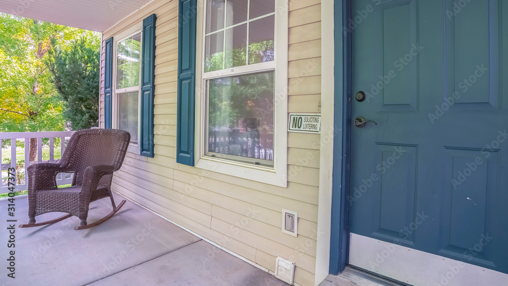 Fototapeta premium Panorama frame Comfortable rocking chair on a covered porch