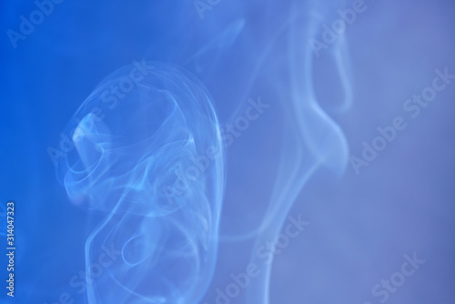 Smoke from an incense stick with color foils Photographed in the studio