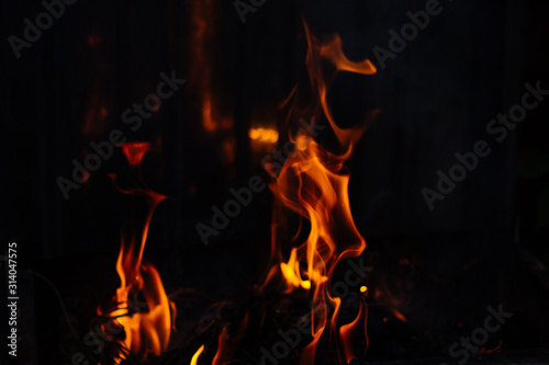 Flames on a dark background. Fire bonfire.
