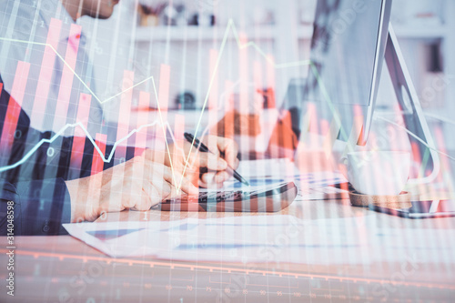 Wallpaper Mural Forex graph with businessman working on computer in office on background. Concept of hardworking. Closeup. Multi exposure. Torontodigital.ca