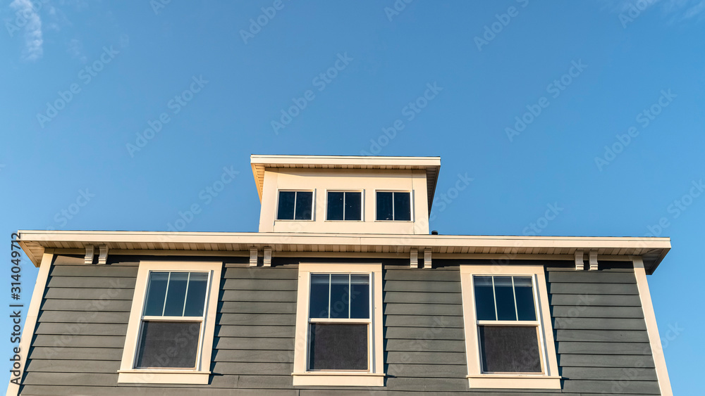 Panorama frame Grey wooden house with three upper windows
