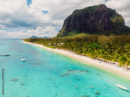 Luxury beach with Le Morne mountain in Mauritius. Beach with palms and ocean. Aerial view © artifirsov