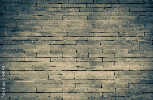 Dark brick wall pattern background, vintage tone style photo