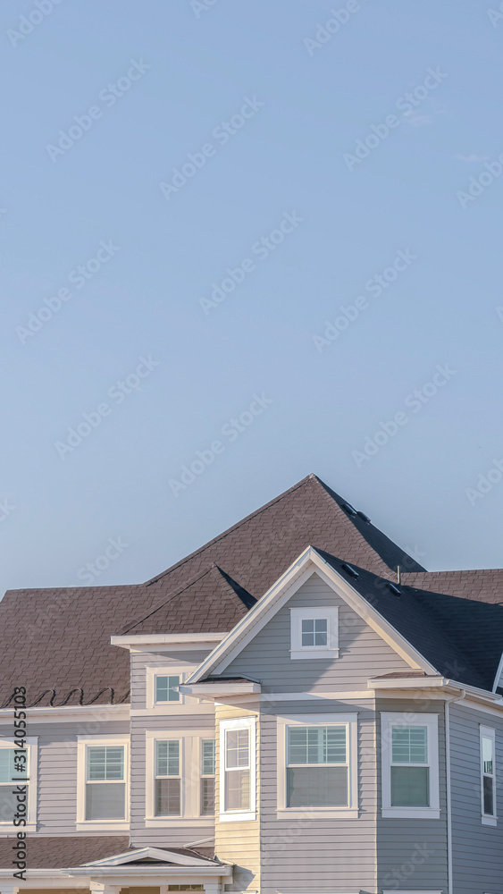 Vertical frame Modern upper floor of a grey timber house