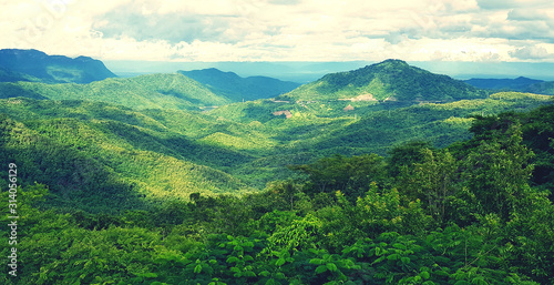 ฺฺBeautiful landscape of mountain. Green forest or jungle with mountain heel and cloud sky. Beauty of nature and Natural wallpaper concept 