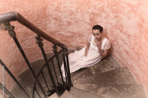 Foto Sitting on spiral staircase