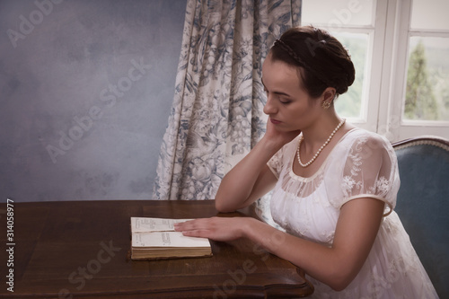 Vintage lady reading book photo