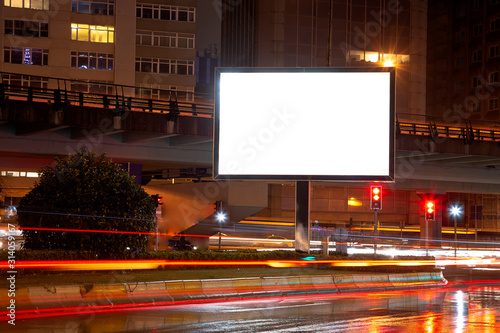 Blank billboard on night street