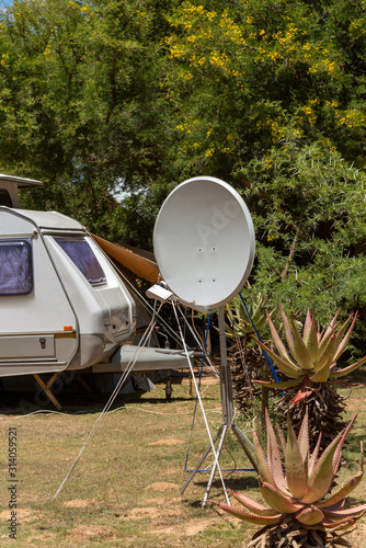 Fototapeta Naklejka Na Ścianę i Meble -  Swellendam, Western Cape, South Africa. December 2019. Portable satellite dish on a campsite in Africa