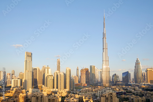 Dubai city skyline with Burj Khalifa skyscraper in a sunny day, blue sky