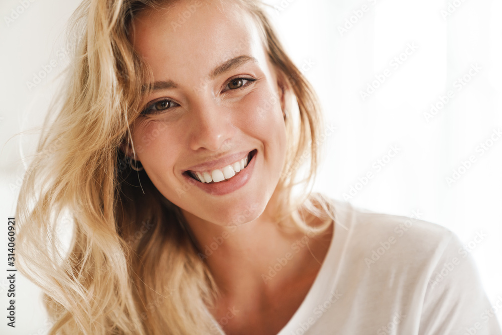 Smiling young beautiful blonde woman wearing t-shirt Smiling young beautiful blonde woman wearing t-shirt