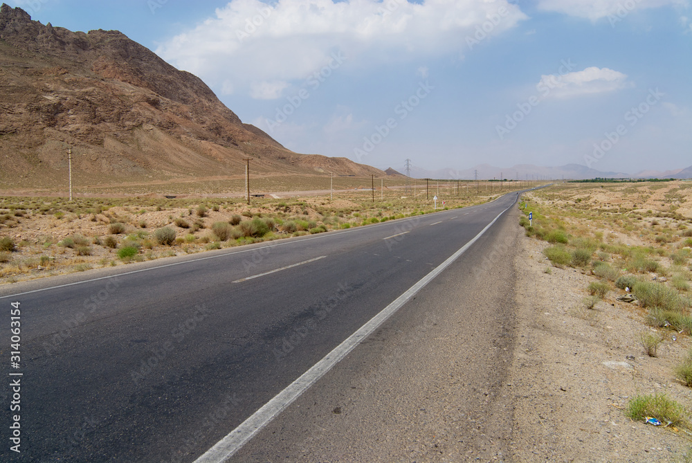 Countryside asphalt road circa Yazd, Iran.