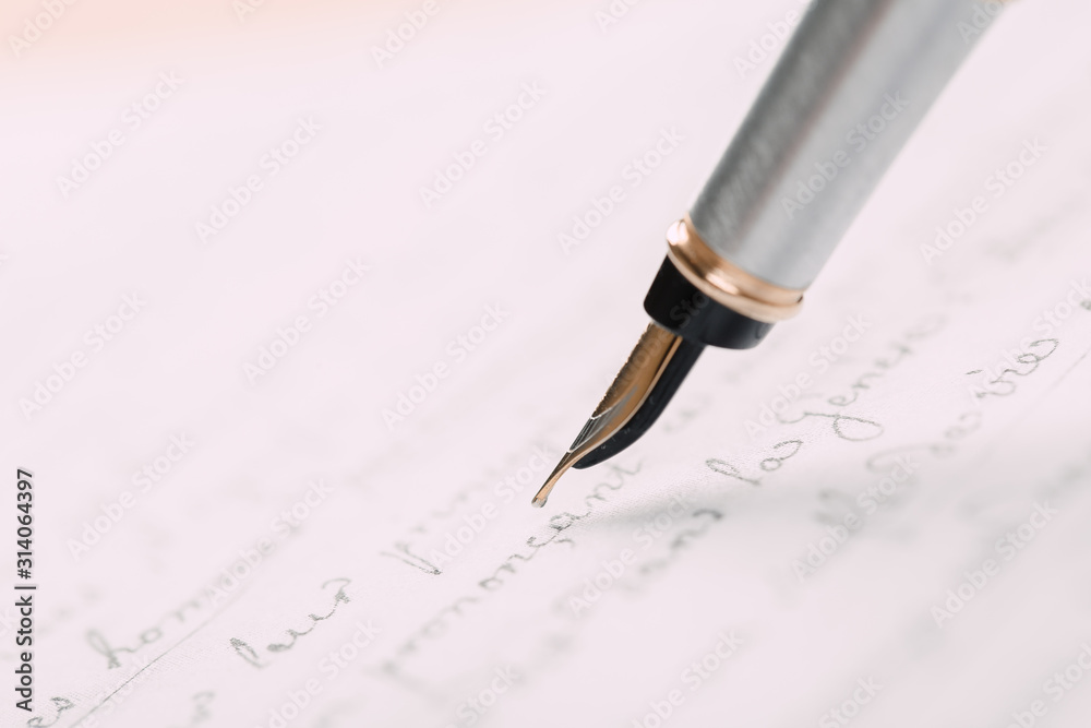 Fountain pen on an ancient handwritten letter. Old story. Retro style. Fountain pen on an ancient handwritten letter. Old story. Retro style.