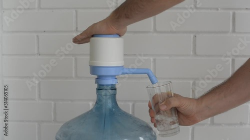 Hand water pump. Water pump for home and office use. Drinking Water bottles with manual pump dispensers.