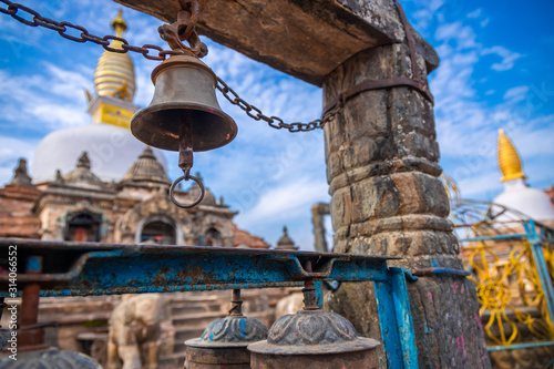 Metal bell hanging infront of a sacred monastery in Kathmandu, Nepal. Buddhist Gompa. Buddhism. photo