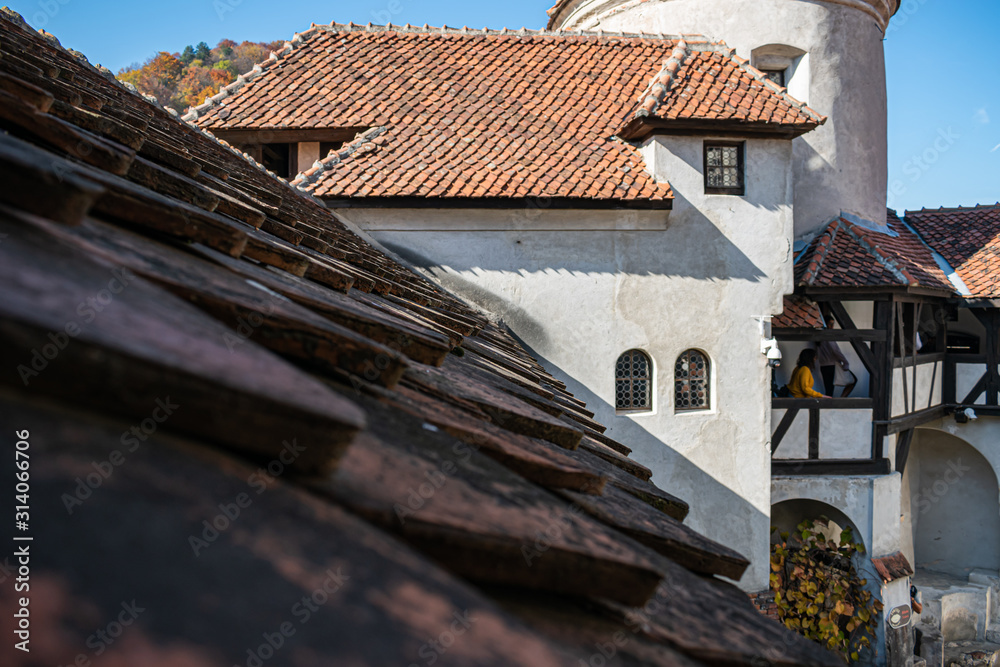 the top of the Bran castle seen from an old window. beautiful view. the top of the Bran castle seen from an old window. beautiful view.