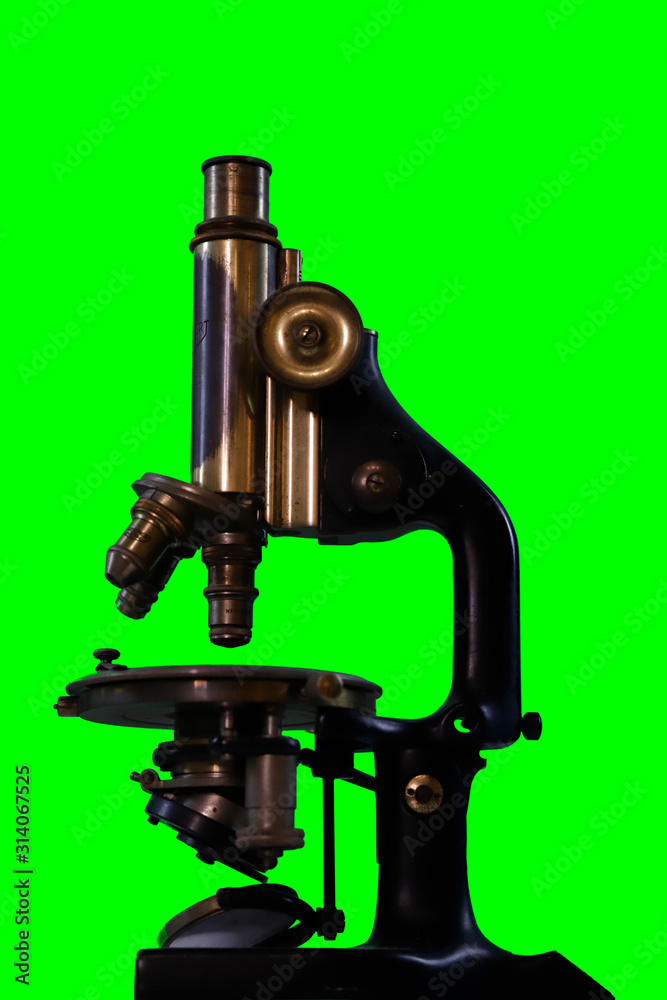Old microscope - green background for alpha