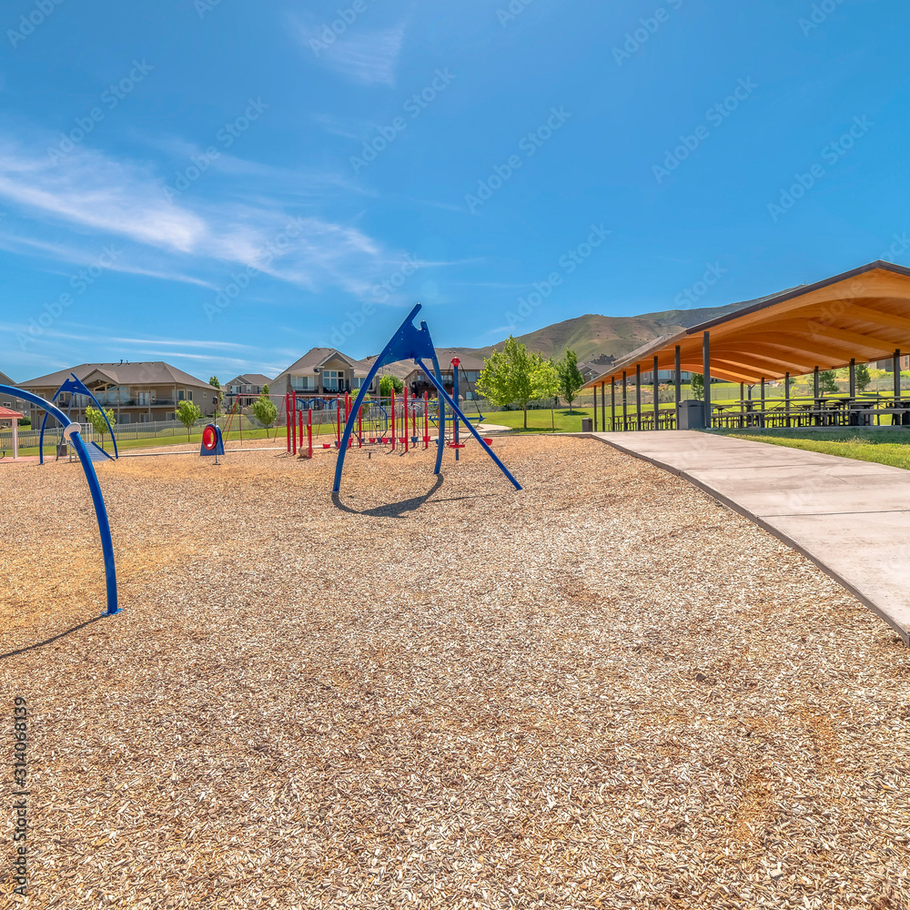 Square frame Pavilion and childrens playground at a park against scenic Timpanogos Mountains