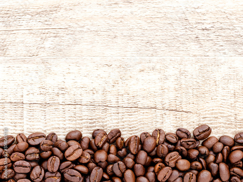 Coffee on wooden background.