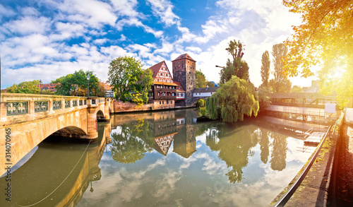 Nurnberg. Pegnitz river weaterfront Weinstadel and Henkersteg in Nuremberg sunrise view photo