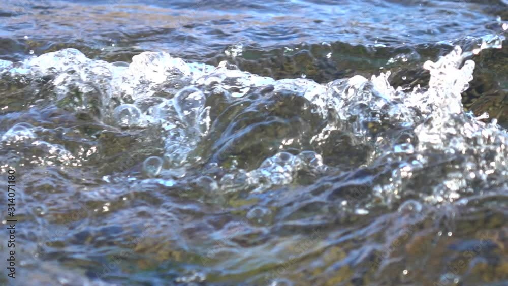 Mountain river at sunset, slow motion Mountain river at sunset, slow motion