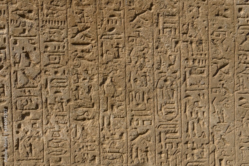 Egyptian ancient hieroglyphs on the stone wall