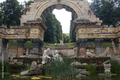 antique ruins, fountain, sculptures, water, grass © Olena